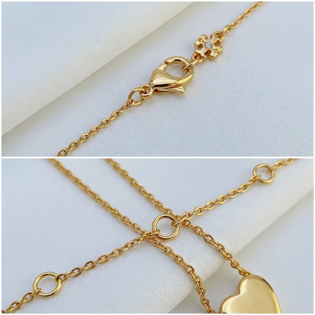 Detailed shot of the secure lobster clasp and adjustable extender on the gold heart necklace