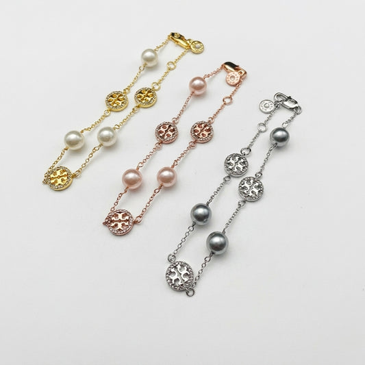Tory Burch Pearl Chain Bracelet in gold-tone finish with high-luster cream pearls