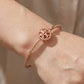 Close-up of the Tory Burch Rope Cuff showing the oval shape for a comfortable, ergonomic wrist fit