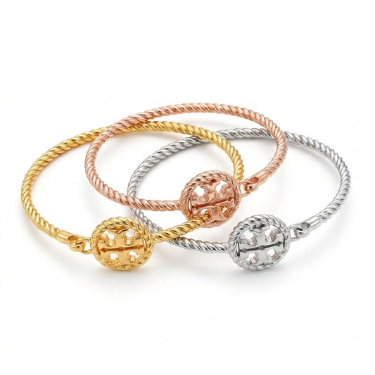 Tory Burch Rope Logo Hinged Cuff Bracelet in gold-tone finish with textured rope design