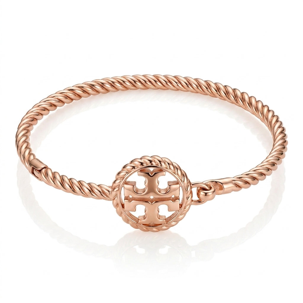 Tory Burch Rope Logo Hinged Cuff Bracelet in gold-tone, featuring a textured twisted rope design