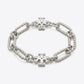 Tory Burch Roxanne Chain Bracelet in polished gold-tone featuring bold sculptural links and Double T logo