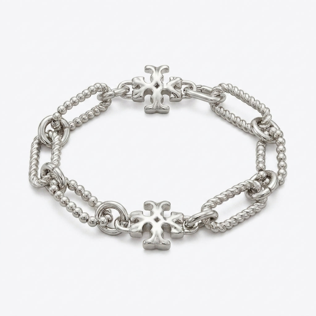 Tory Burch Roxanne Chain Bracelet in polished gold-tone featuring bold sculptural links and Double T logo