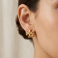 Model wearing Tory Burch Roxanne Large Studs, showing the statement effect for occasion styling