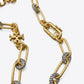 Macro detail of the precision crystal pavé setting and gold Double T logo on the Roxanne cuff