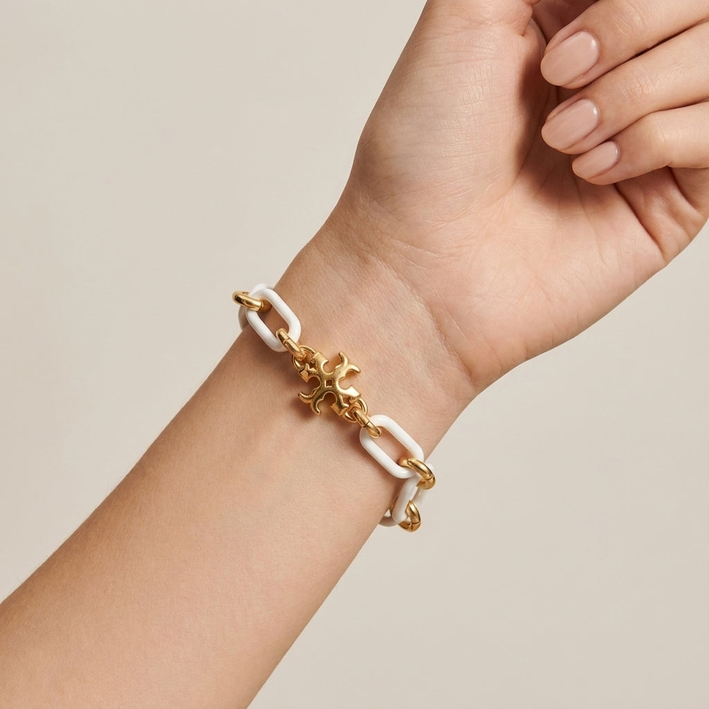 Model wearing Tory Burch Roxanne Short Chain Bracelet, perfect for effortless luxury layering