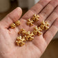 Hand-held size reference of Tory Burch Roxanne Large Studs to show the oversized scale