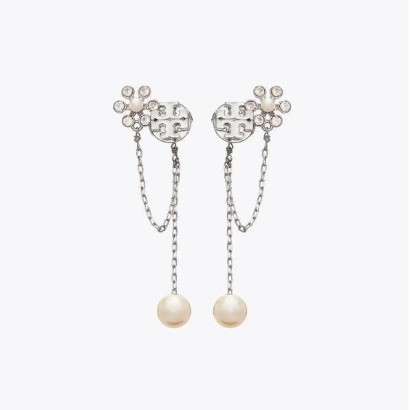 Studio display of Tory Burch silver moondance pearl chain drop earrings with crystalline flower and hanging pearl chain.