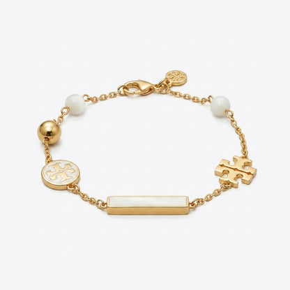Tory Burch TB Logo and Pearl Bracelet in gold-tone featuring polished Double T and cream pearls