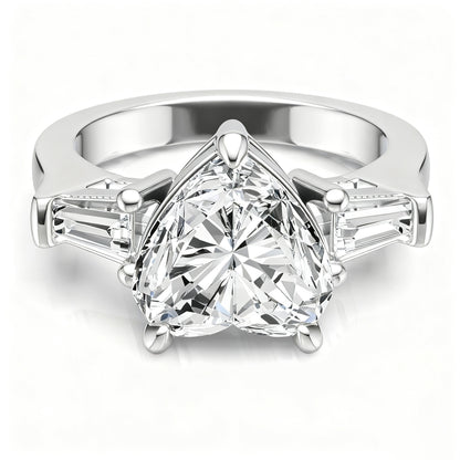 Trillion cut moissanite three-stone ring with tapered baguette side stones on white background.