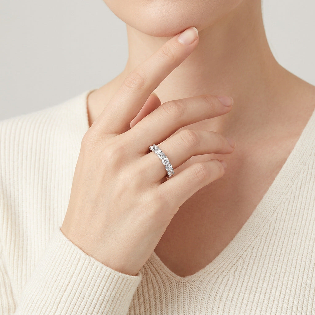 odel wearing the elegant U-shape moissanite half eternity stackable ring in a lifestyle portrait.