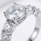 Micro macro view focusing on the under halo pave setting and intricate vintage detailing of a moissanite anniversary jewelry ring.