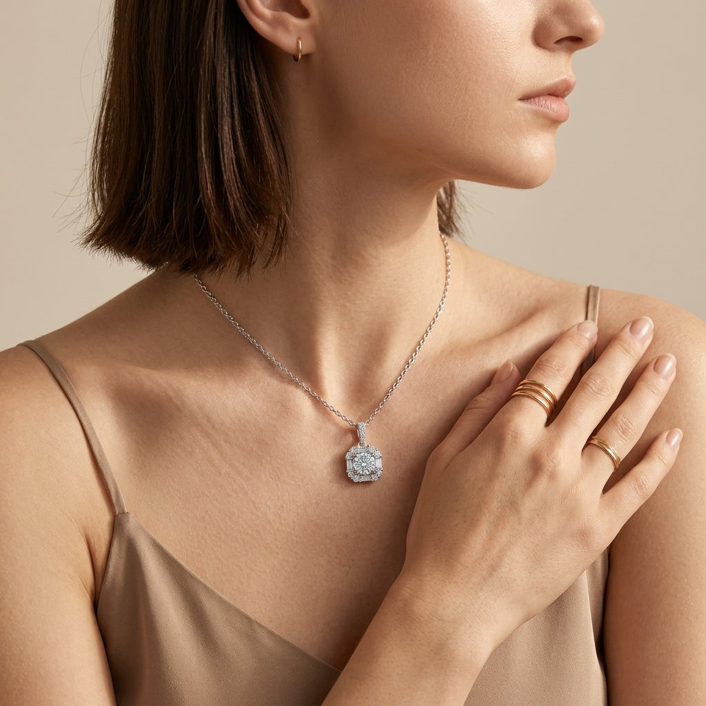 Alternative neckline view of model wearing vintage baguette halo diamond pendant.