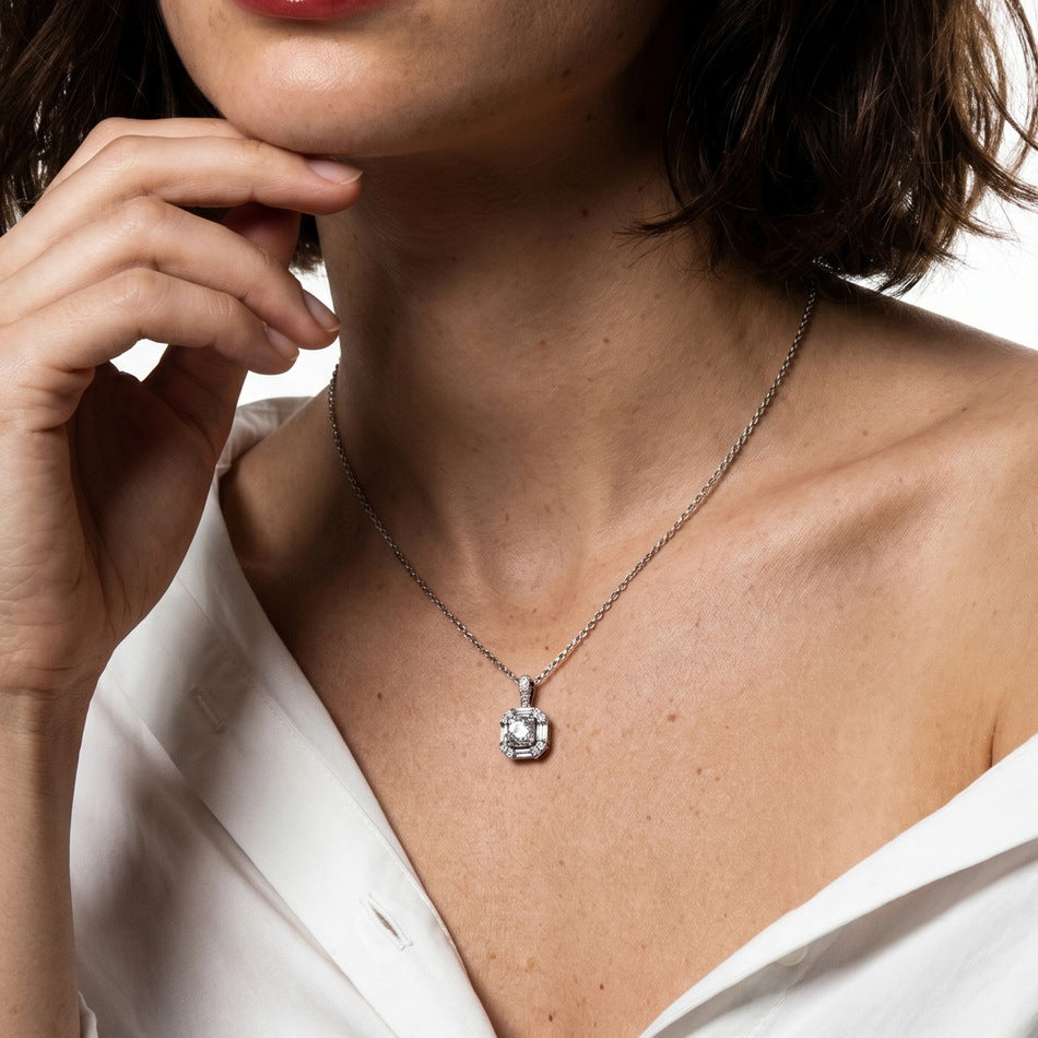 Model wearing vintage geometric baguette halo lab grown diamond pendant necklace.