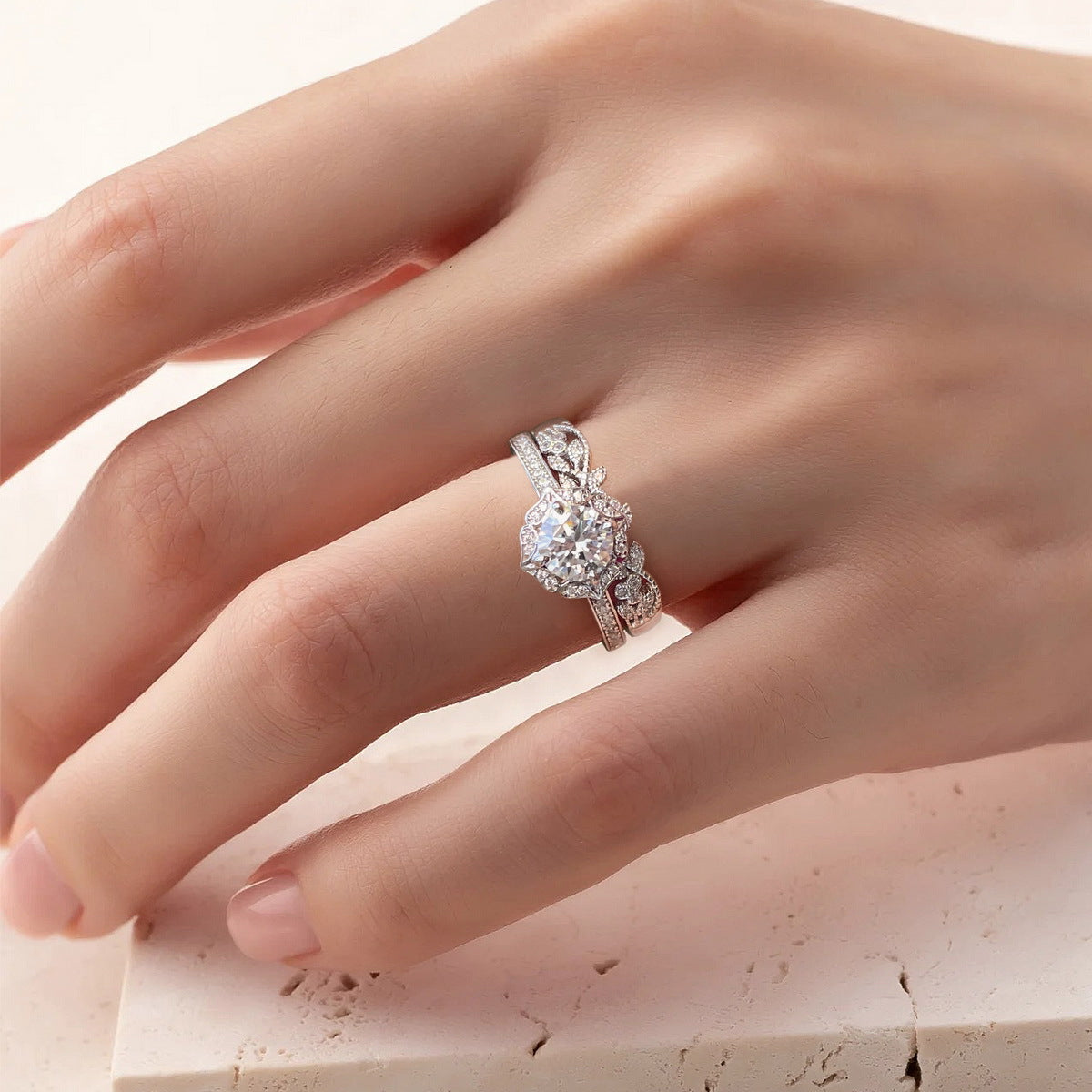 Model wearing vintage milgrain halo lab grown diamond engagement ring on finger