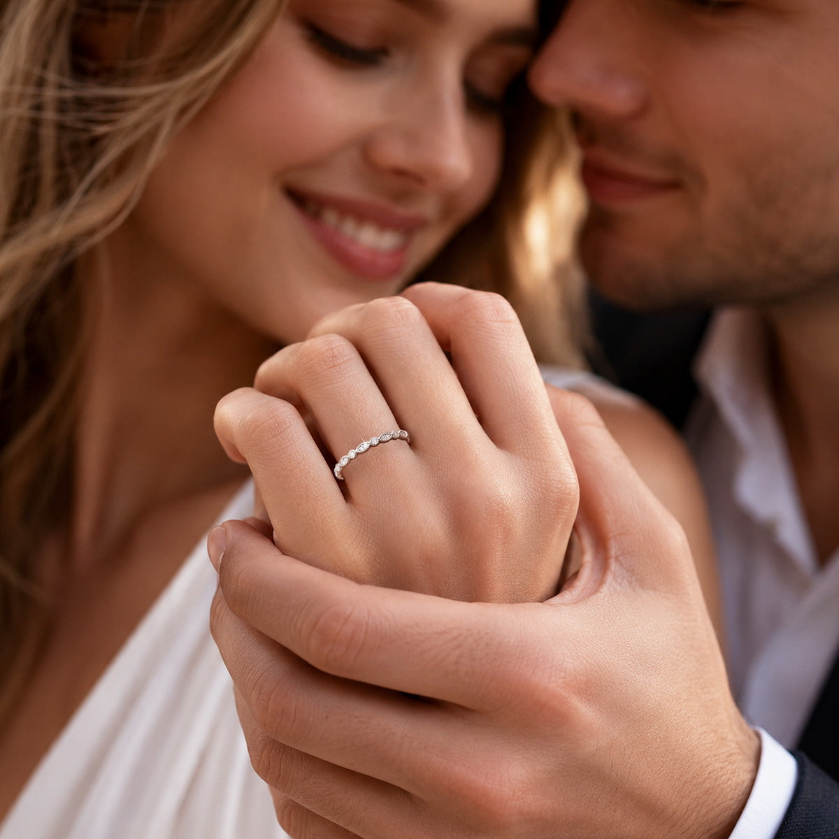 Couple holding hands showing delicate vintage milgrain lab grown diamond wedding band
