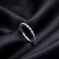 Side profile view of vintage milgrain marquise and round lab grown diamond band standing on black silk