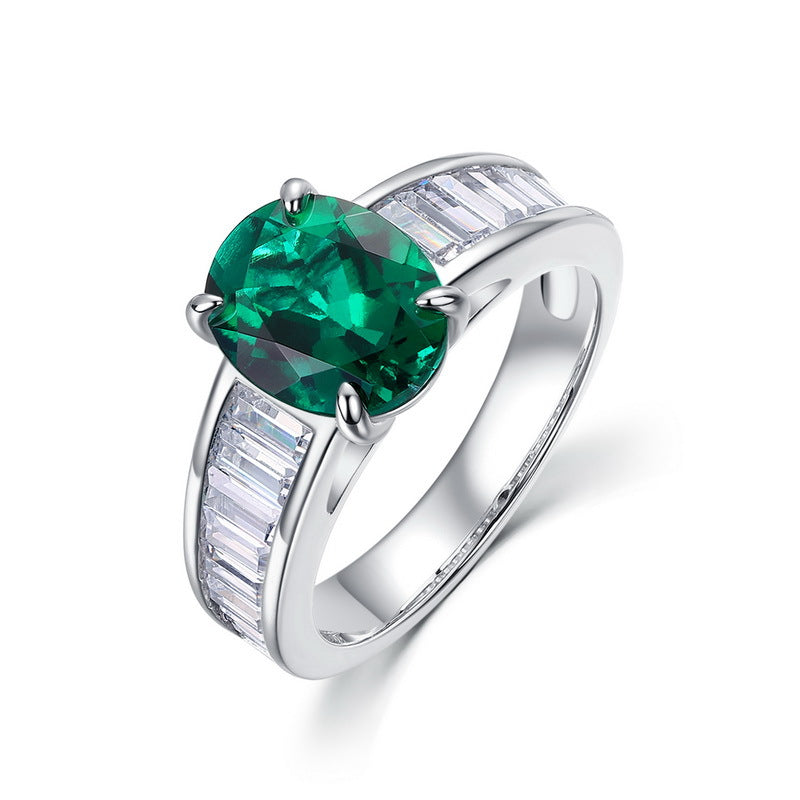 Vintage lab-grown classic oval-cut emerald ring for women with baguette side diamonds in 925 silver.