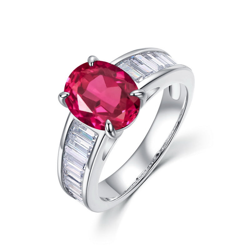 Vintage lab-grown classic oval-cut ruby ring for women with baguette side diamonds in silver.