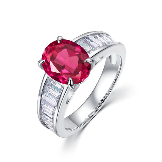 Vintage lab-grown classic oval-cut ruby ring for women with baguette side diamonds in silver.