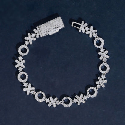 XOXO moissanite tennis bracelet in 925 sterling silver with iced out box clasp.